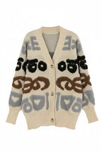 Beige cardigan with abstract pattern on a white background