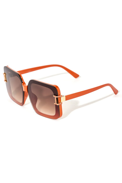 Sunglasses with orange frame and gradient lenses on a white background