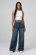 Wide-leg jeans worn by a person on a plain background