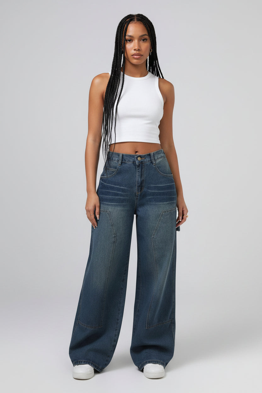 Wide-leg jeans worn by a person on a plain background