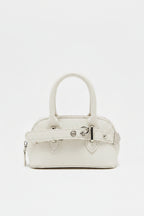 white handbag with a strap on a white background