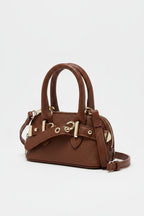 Brown handbag with silver hardware on a light gray background