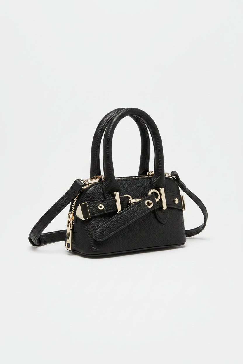 Brown handbag with silver hardware on a light gray background