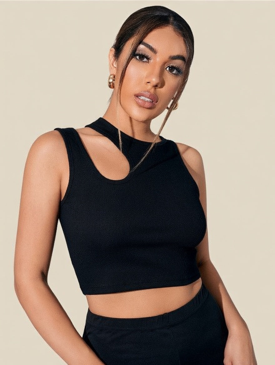 Woman wearing a black sleeveless top against a beige background