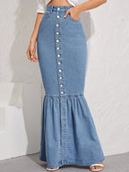 Denim skirt with button details worn by a person on a white background
