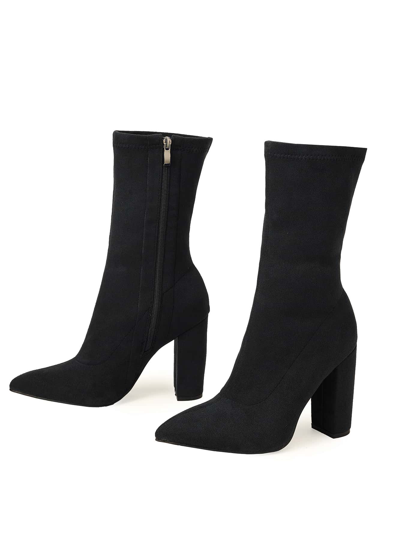 Black sock boots with block heels on a white background