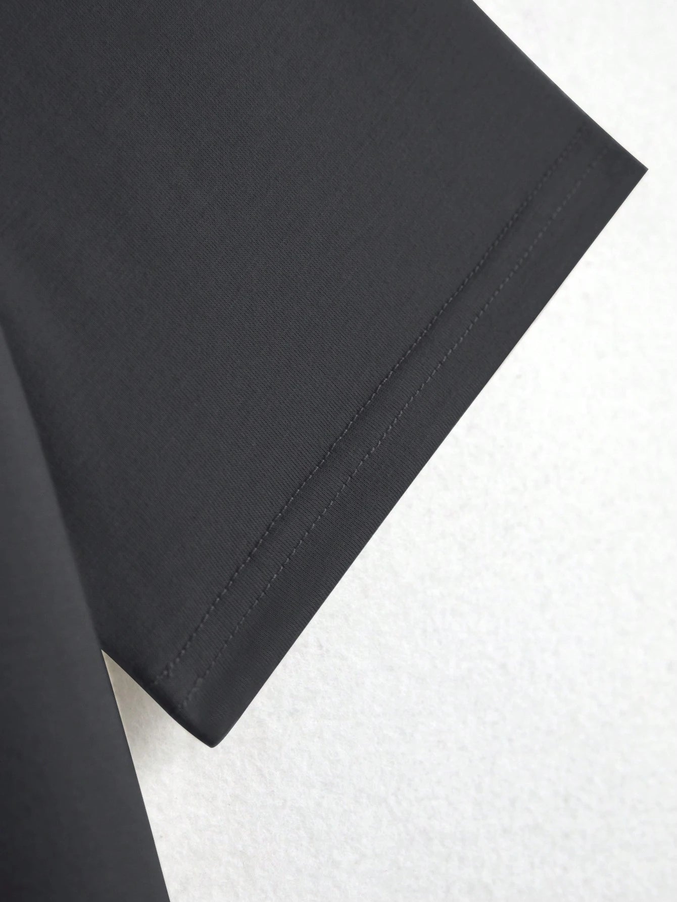 Close-up of black fabric on a white background