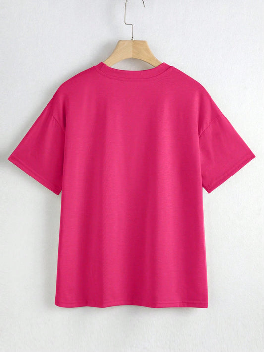 Pink t-shirt on a hanger against a white background