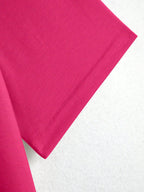Close-up of a pink fabric corner on a white background