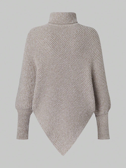 Knitted poncho on a light gray background