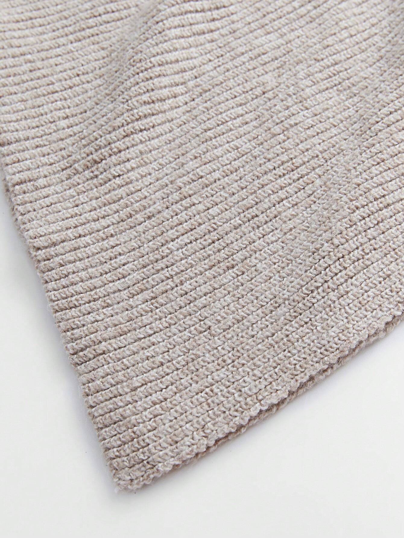 Close-up of a textured beige rug on a white background