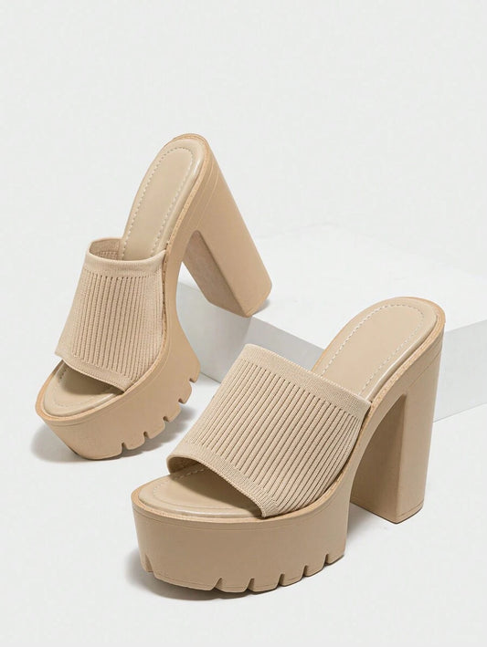 Beige platform sandals on a white background