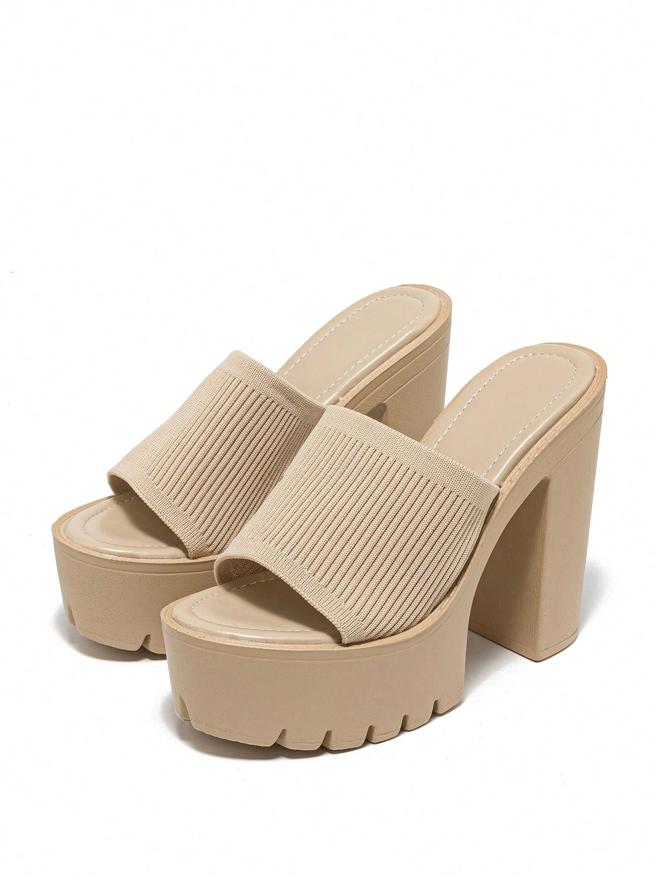 Beige platform sandals on a white background