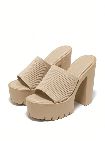 Beige platform sandals on a white background