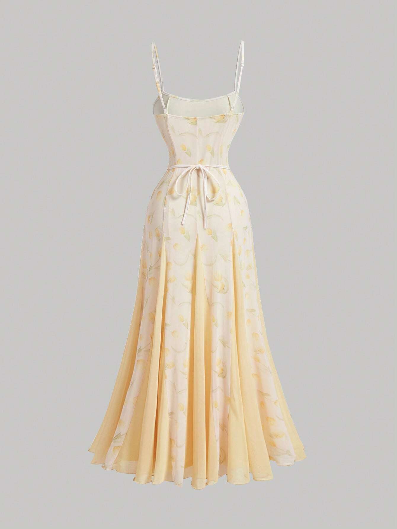 Yellow floral dress on a gray background