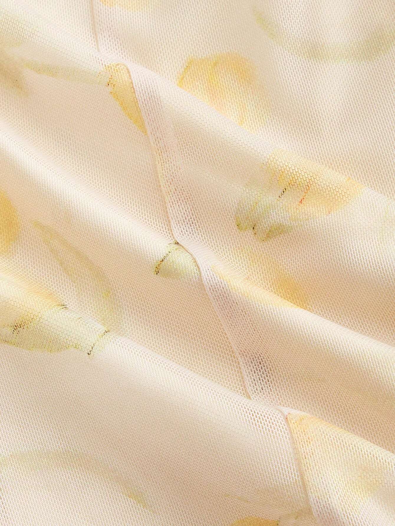 Close-up of a textured fabric with yellow accents on a light background