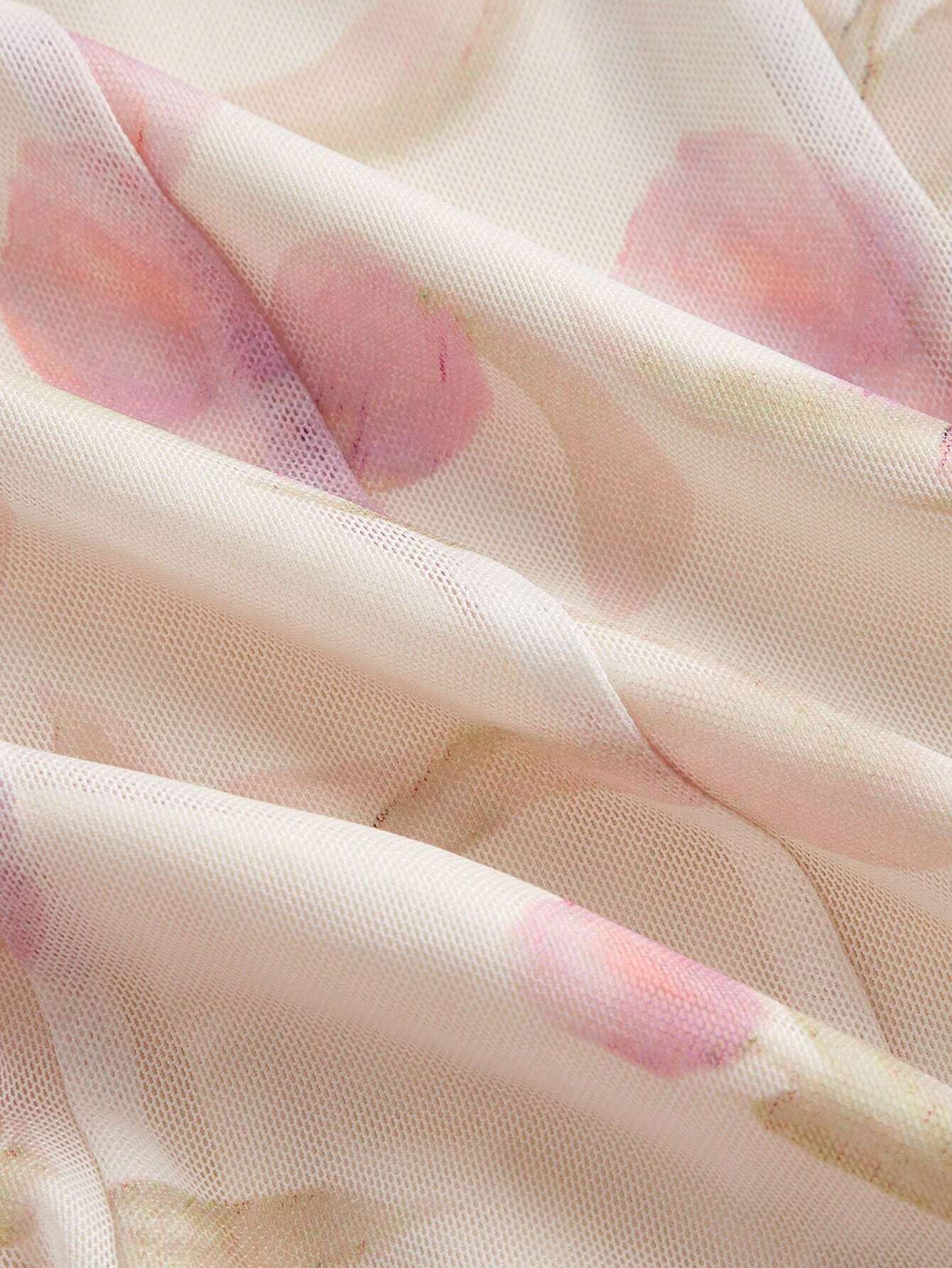 Close-up of sheer fabric with pink floral patterns