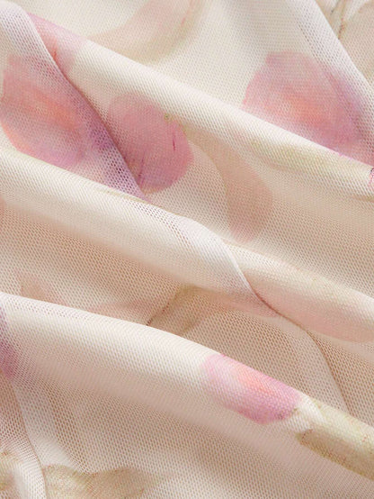 Close-up of sheer fabric with pink floral patterns