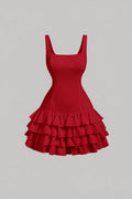 A red sleeveless mini dress with a square neckline, tiered and ruffle hem, and a natural waistline.