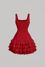 Red dress with ruffled skirt on a gray background