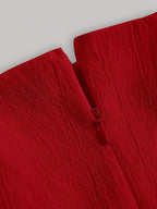 Close-up of a red fabric texture on a white background