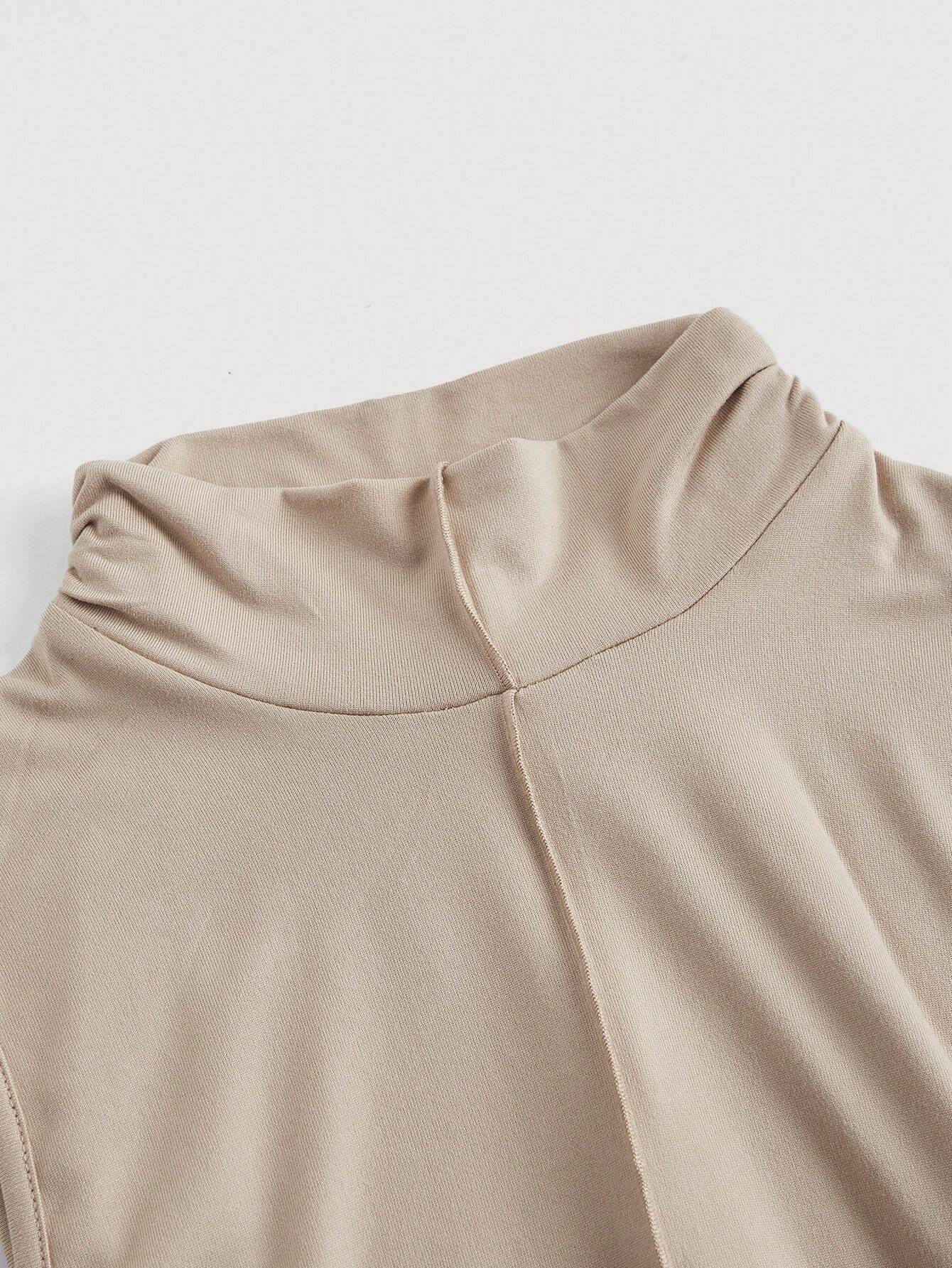 Close-up of beige fabric with a plain background