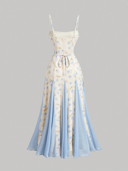 Floral dress with light blue overlay on a gray background