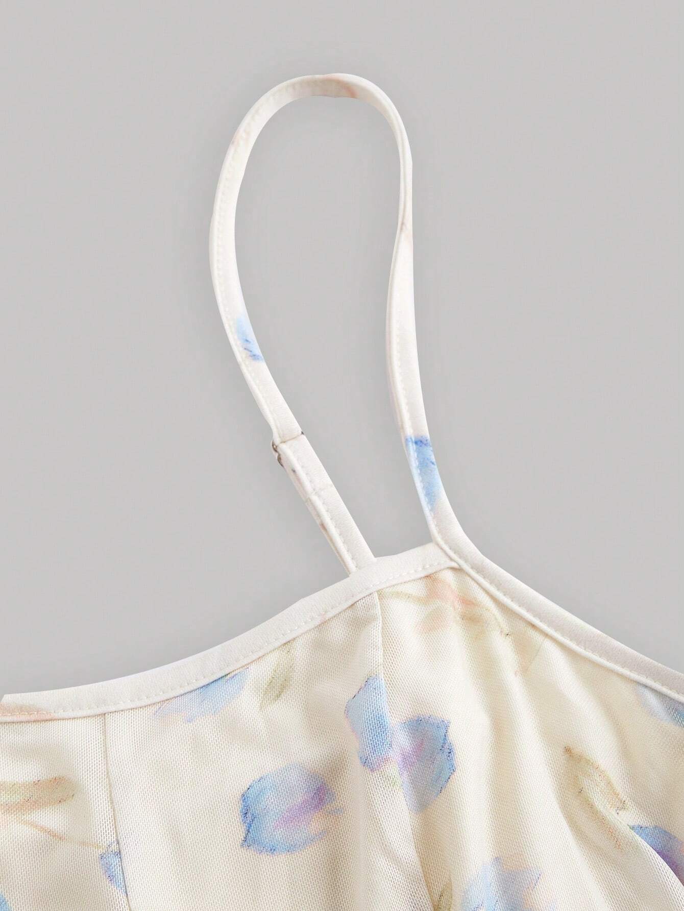 Close-up of a top with thin straps on a gray background
