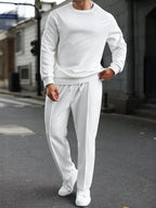 Person wearing a white outfit on a street