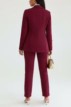 Person wearing a burgundy set in a bedroom setting