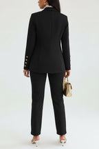 Person wearing a black suit with a white background