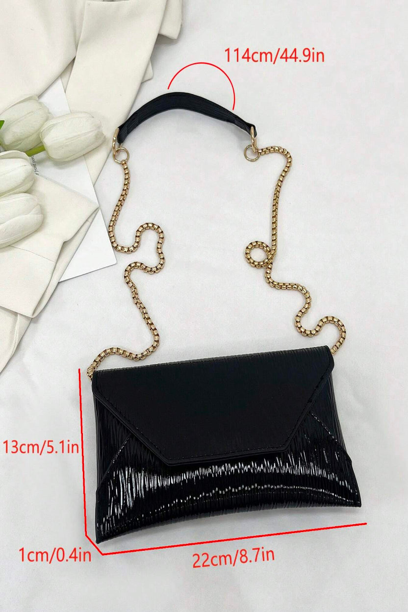 Black clutch bag with chain strap on a white background, showing measurements.