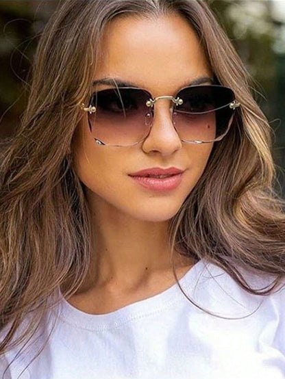 Woman wearing sunglasses with a blurred natural background