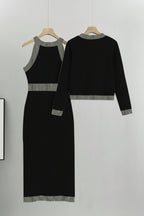 Black dress with silver trim on hangers against a gray background