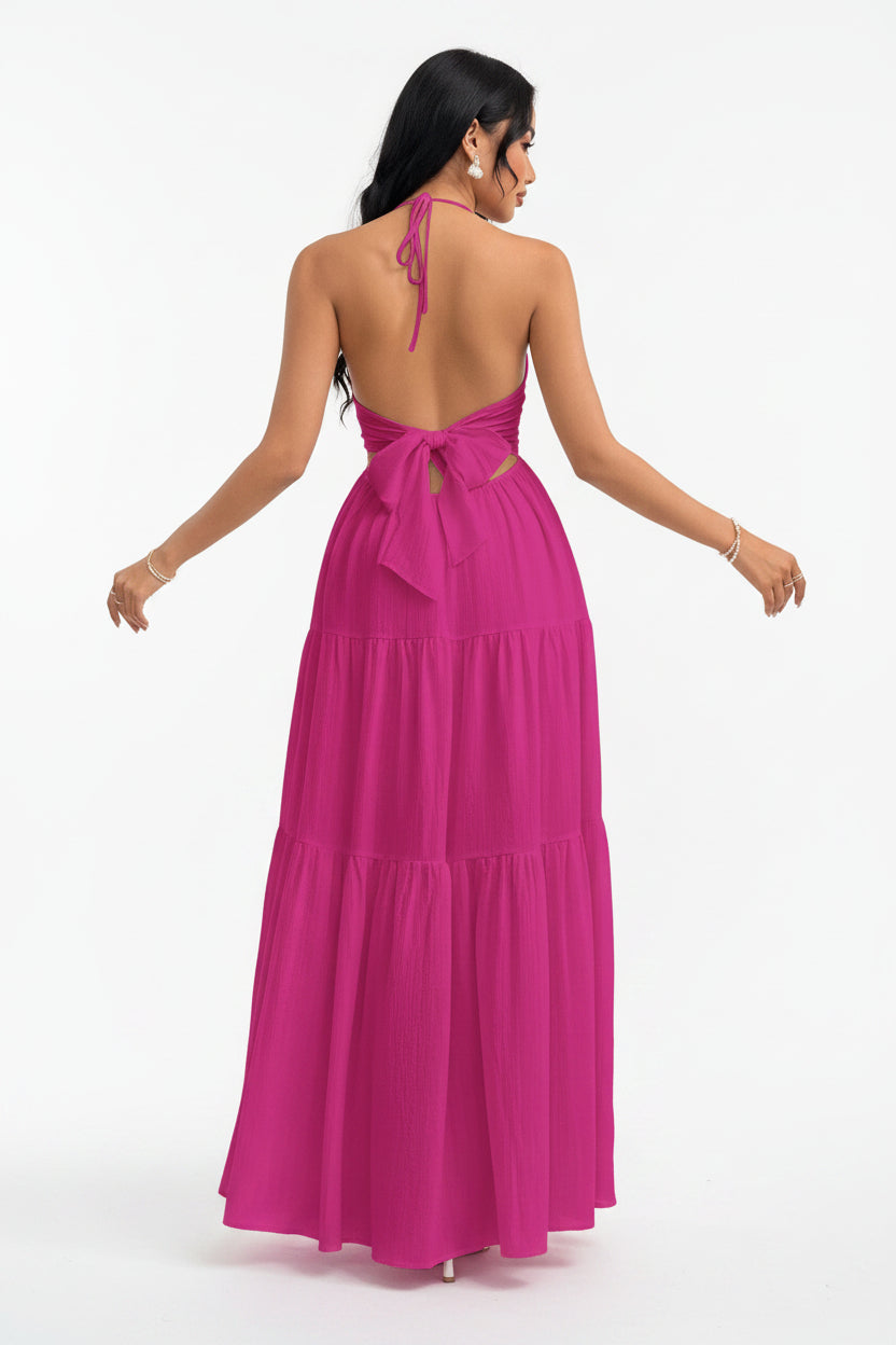 Woman wearing a pink dress with a white brick wall background