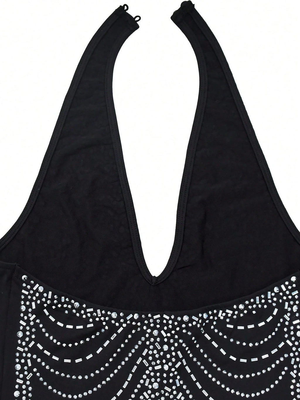 Black tank top with decorative silver beads on a white background