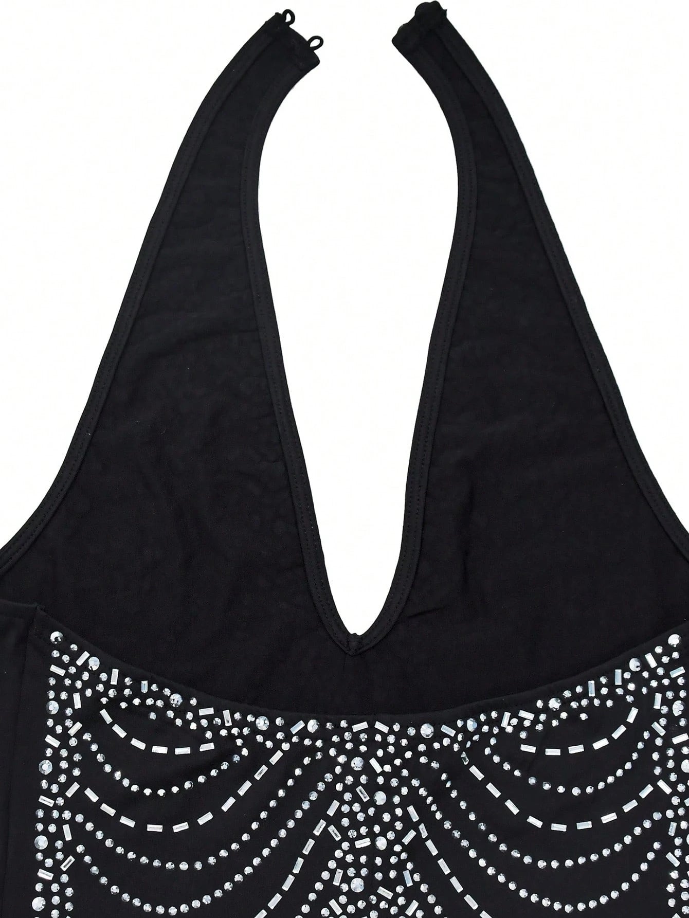 Black tank top with decorative silver beads on a white background