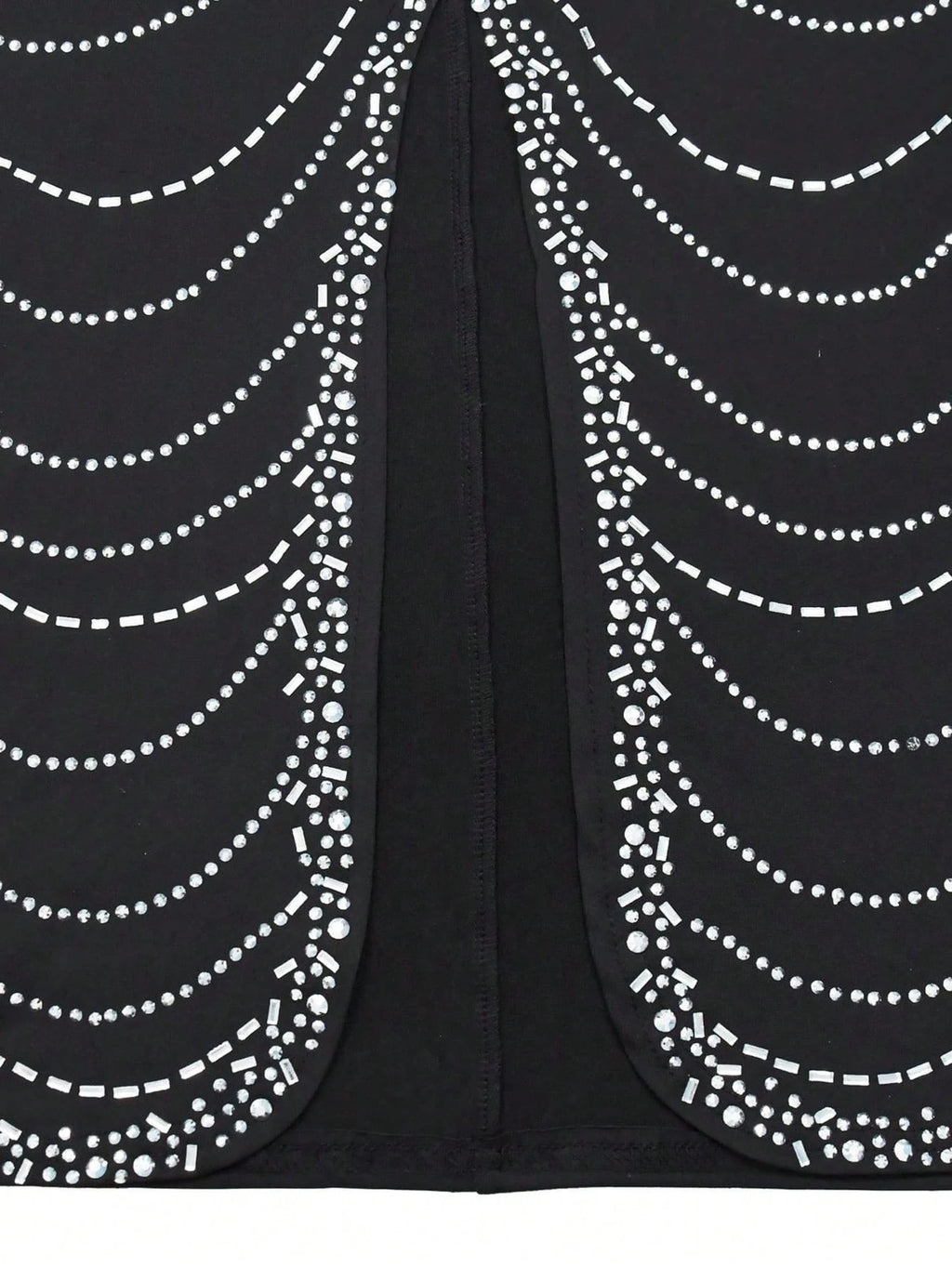 Black fabric with white bead patterns on a black background