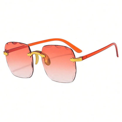 Sunglasses with orange gradient lenses and gold accents on a white background