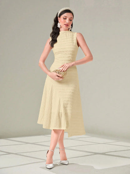 Woman wearing a light yellow dress with a plain background