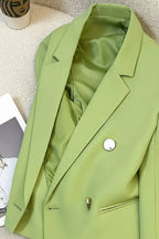 Light green blazer on a mannequin against a neutral background