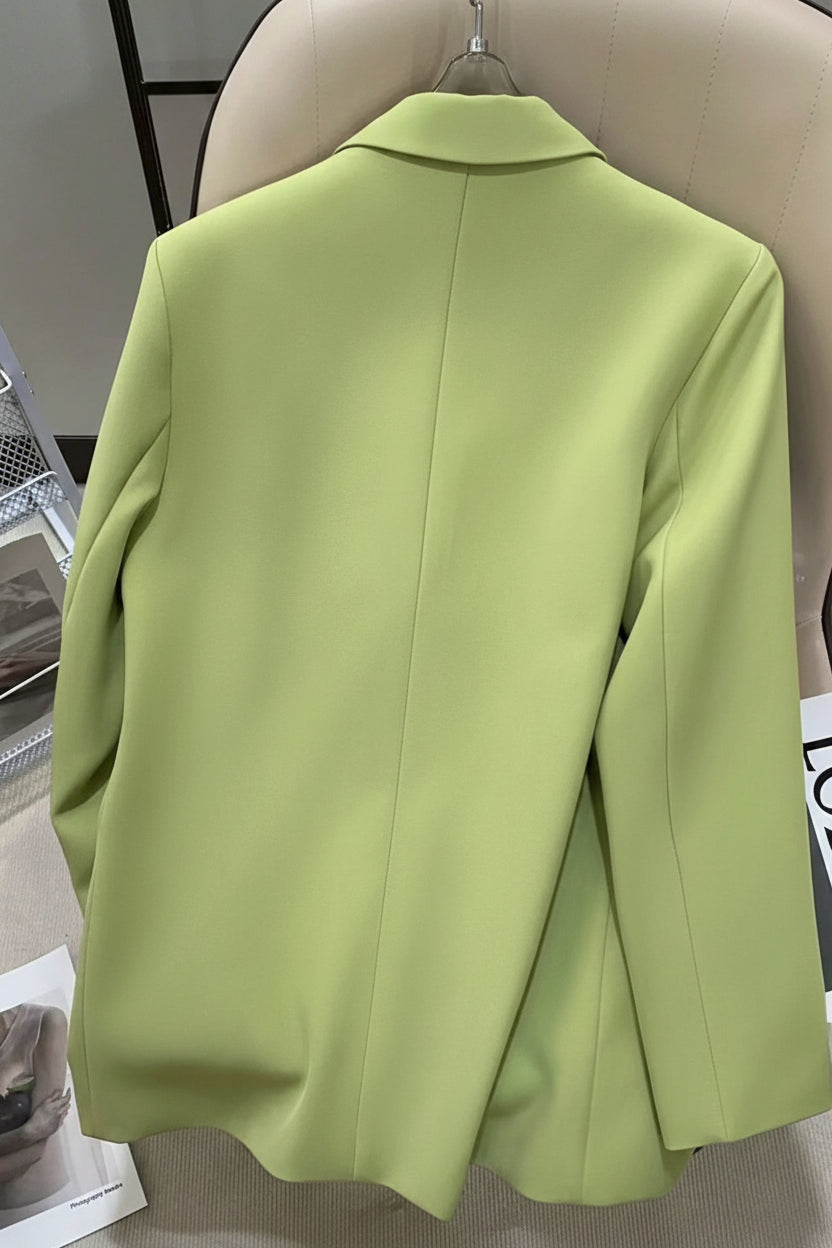 Light green blazer on a mannequin against a neutral background