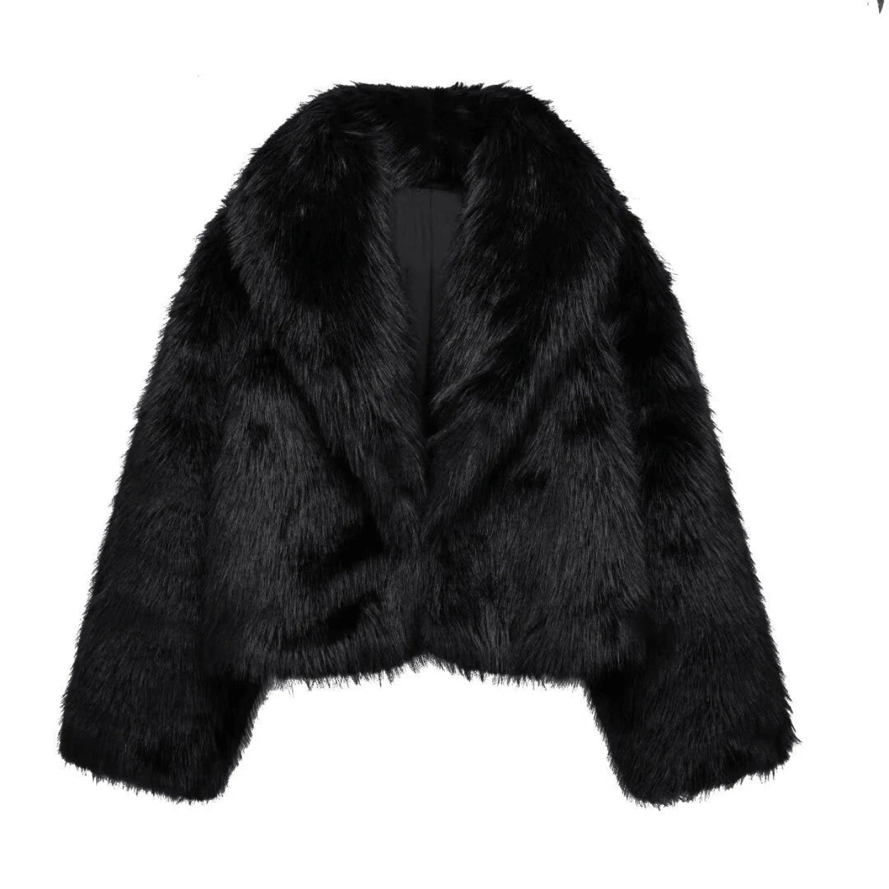 Black faux fur jacket on a white background