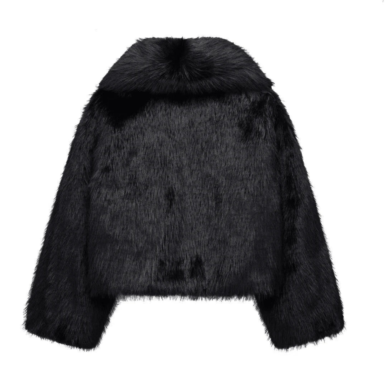 Black faux fur jacket on a white background