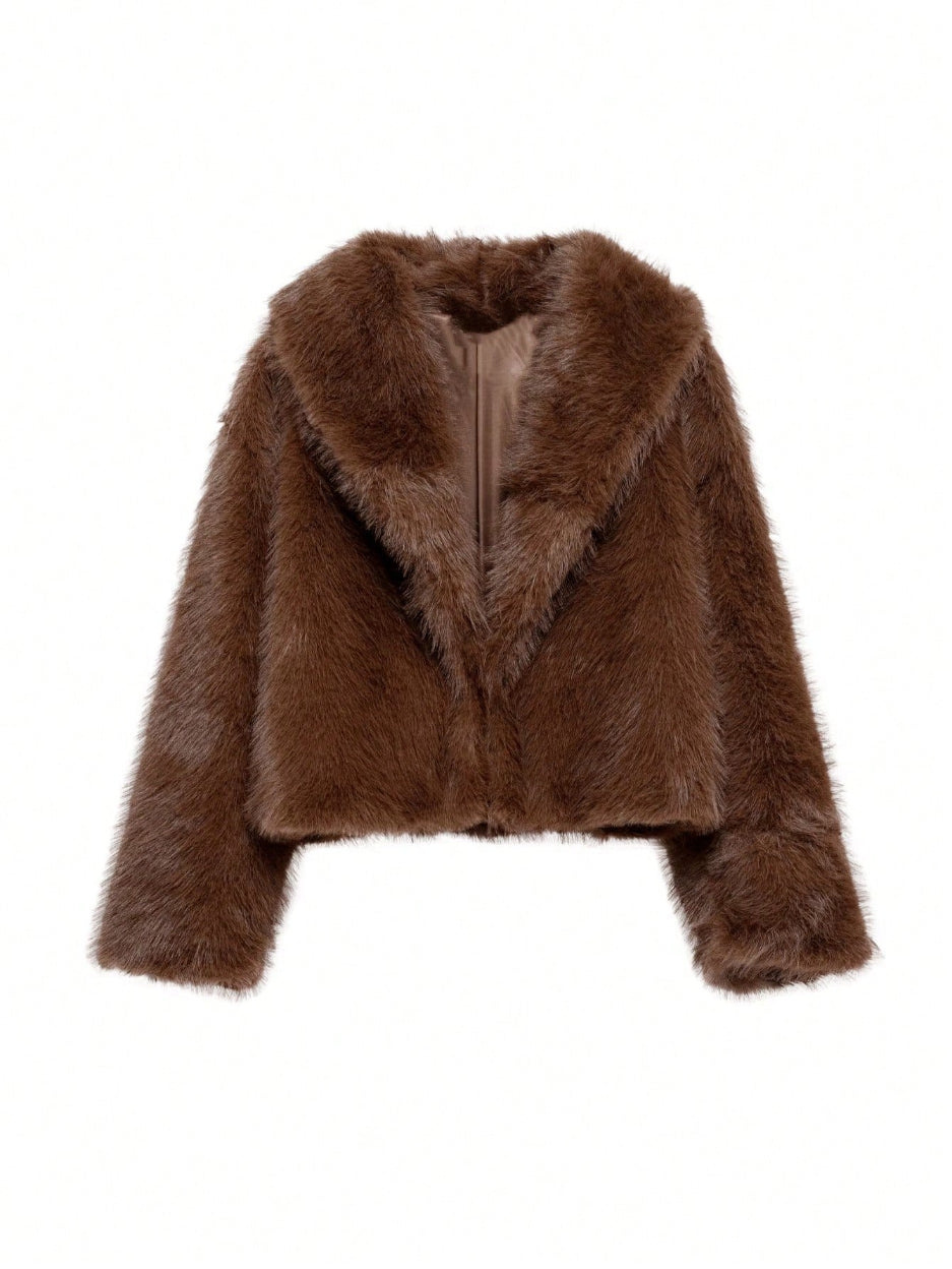 Brown fur jacket on a white background
