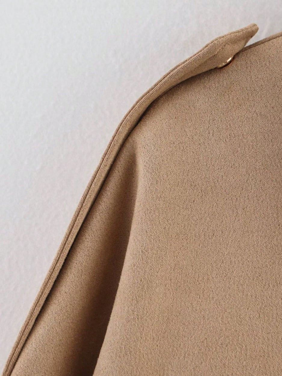 Close-up of a beige fabric texture on a light background