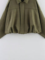Green coat on a white background