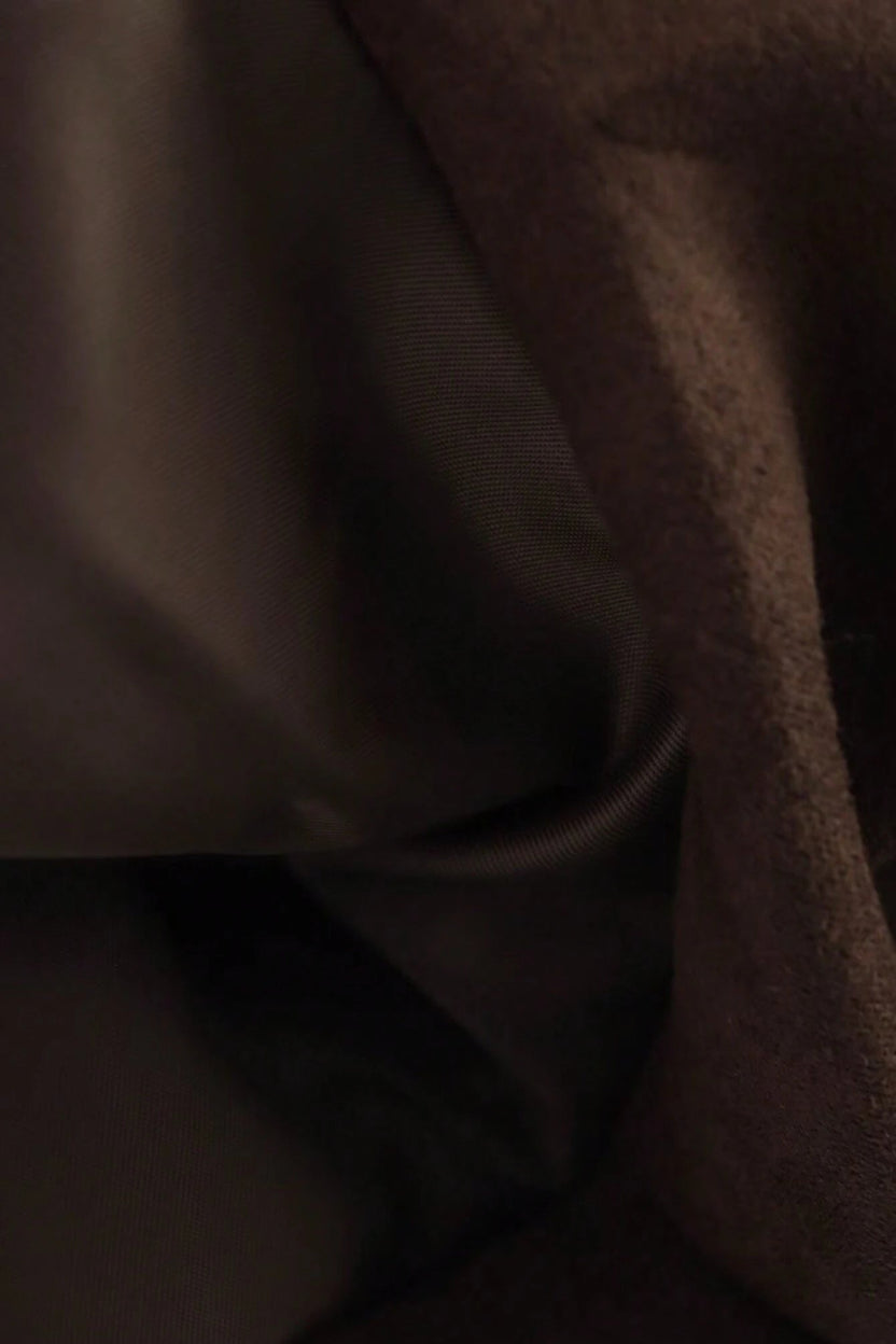Close-up of dark brown fabric texture