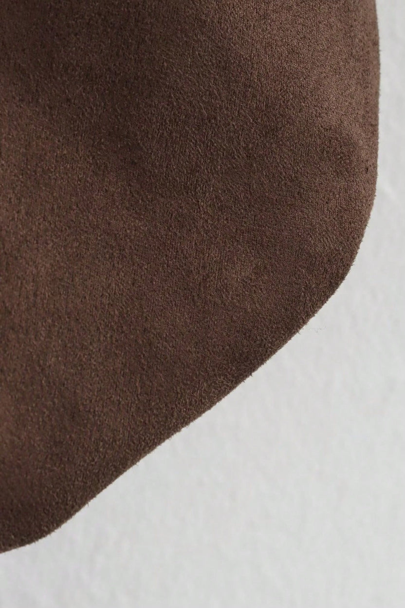 Brown fabric texture on a white background
