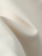 Close-up of beige fabric with a subtle texture
